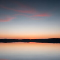 Obraz premium Beautiful sunset over the lake and river, with orange sunlight reflecting on the water, clouds painting the blue sky, and nature's landscape at dusk