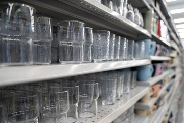 Close up of clear drinking glasses on store shelf.