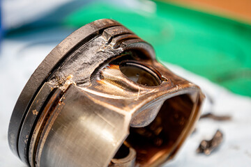Broken engine piston, broken piston parts, engine damage and further repairs