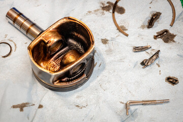 Broken engine piston, broken piston parts, engine damage and further repairs