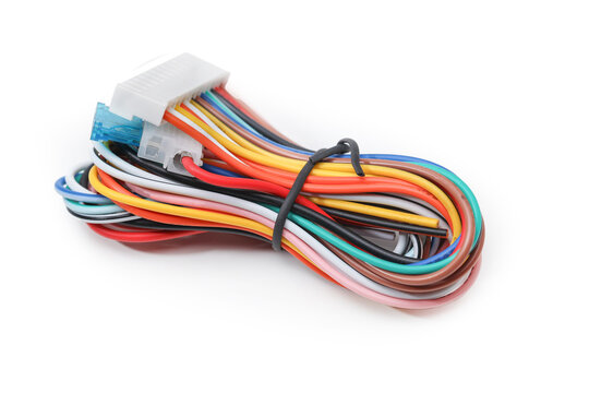 Multi-colored electrical wires with a fuse, intended for connecting a car radio, on a white background.