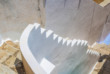 Top view of old  stone staircase the white railing, Symi island, Greece