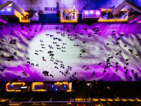 Aerial view of ice skating rink in Montreal with colorful lights and winter motion. g.