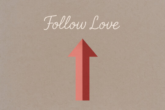 Minimal Valentine’s Day arrow illustration with handwritten text “Follow Love” on urban concrete background