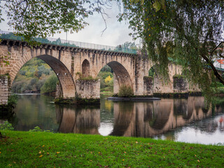 Fototapeta premium Ponte da Barca bridge over Lima river. Ancient portuguese village.