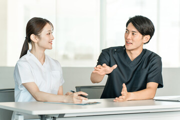 Obraz premium Medical workers in scrubs, medical staff, male doctors and female nurses in white coats 