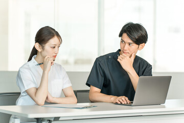 Medical workers in scrubs, medical staff, male doctors and female nurses in white coats
