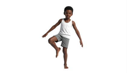 Young boy performing energetic dance kick pose.
