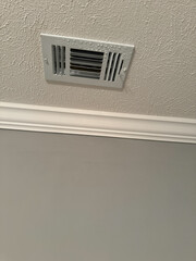 Ceiling Air Vent with Textured Wall Background