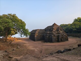 Ancient Krishnai Temple in Mahabaleshwar stands amid serene greenery, showcasing stone architecture...
