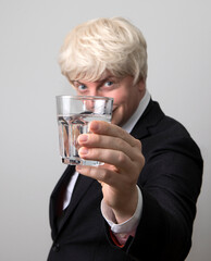 Man drinking glass of water standing. Man water. Drinking. Happy day. New day. 