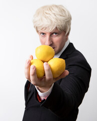 Handsome senior businessman with lemon. Fruits. Business concept. Lemon. Work. Happy day. Diet. 