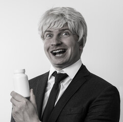 portrait of businessman with bottle pills. Emotion man face. Smiling face. Pills. Diet. Happy