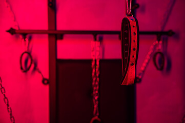 BDSM installation. Wall with chains and handcuffs.