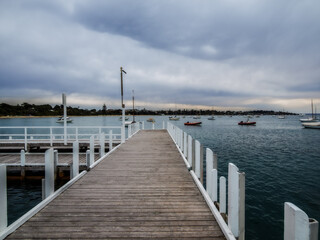 Obraz premium View Along Wooden Pier Gloomy Day