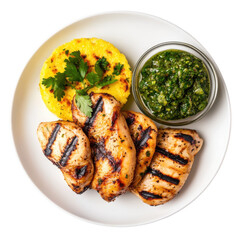 Grilled Chicken with Pesto Sauce and Polenta Cake on a White Plate on transparent background