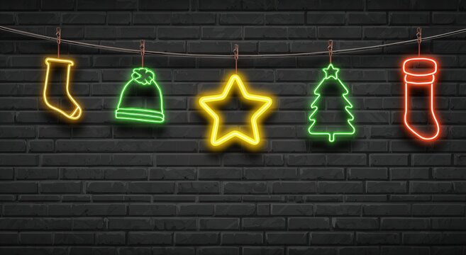 Modern neon Christmas decorations with glowing yellow stocking, green hat, star, tree and red gift box on dark brick wall.