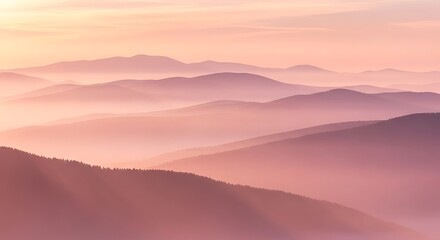 Obraz premium Gentle mountain ranges covered in pink-purple mist at sunrise, casting soft light on the peaks and creating a serene, ethereal vista
