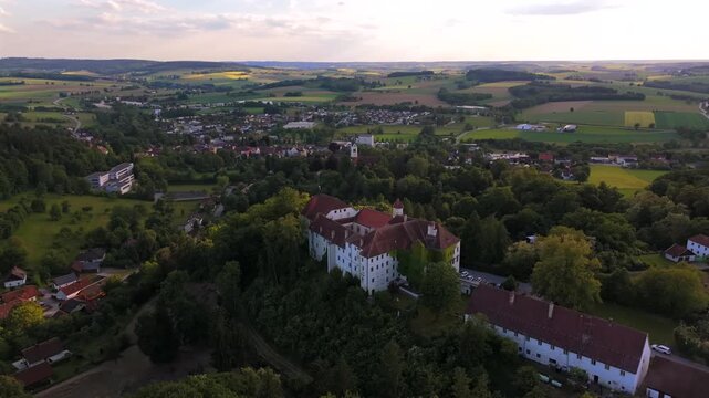 Drone video of Schloss Ortenburg, medieval Hoehenburg in southern Germany. Wildpark, concert grounds and castle museum. Luftaufnahme Schloss Ortenburg, Alt-Ortenburg, Vorderschloss in Ortenburg. 