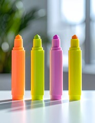 Vibrant Neon Highlighters Lined Up on a White Surface.
