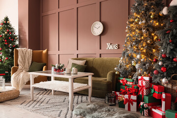 Interior of festive living room with Christmas tree, green sofa and clock