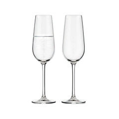 Two empty champagne flutes stand side by side on a black background with a third flute filled with champagne and bubbles isolated on black background
