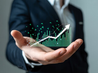 Businessman's hand displaying a rising financial growth chart finance graph