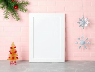 Blank white poster frame with festive christmas decorations on pink background