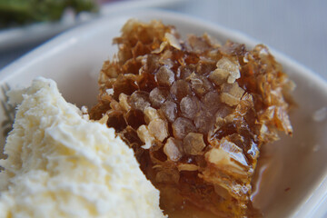 Delicious honeycomb served with creamy butter