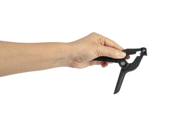 Fototapeta premium A studio shot of a black plastic spring clamp in hand isolated on a transparent background