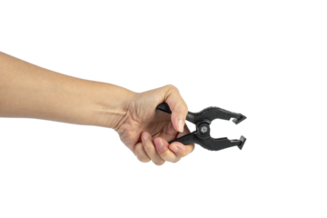 A studio shot of a black plastic spring clamp in hand isolated on a transparent background