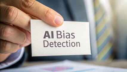 Hands Holding Card with AI Bias Detection Text in Modern Office Environment