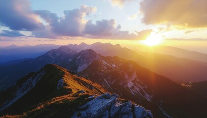 Beautiful mountain range stretches under a bright sunrise with clouds. Ideal for travel brochures, desktop wallpapers, adventure websites, naturethemed designs, inspirational posters.