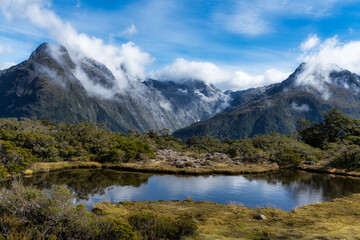 The alpine tarn at the top of The Key Summit, part of the Routeburn Track in New Zealand's Fiordland National Park