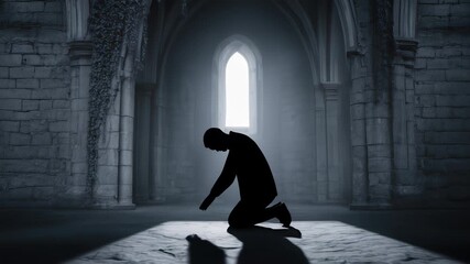Silhouette of a Man Kneeling in Prayer in a Dark Stone Church