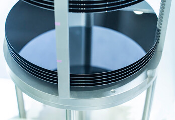 patterned silicon wafers in a universal pod. Electronic circuit designs have been built onto the...