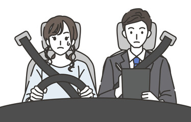 自動車教習所で教官から指導を受ける女性