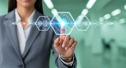 Woman in gray suit touching glowing digital network hexagons with bright blue light technology data