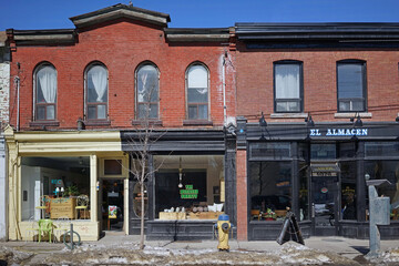 Fototapeta premium Businesses in vintage buildings in the west Queen Street area of Toronto
