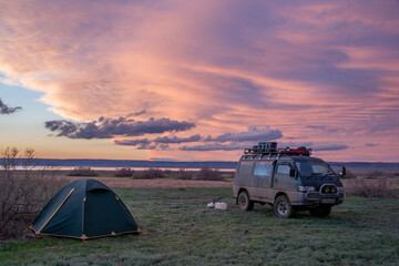 Minibus for travel. Tent camp at sunset