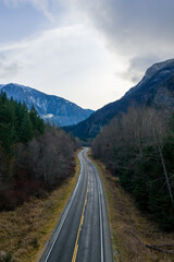 Fototapeta premium Winding Mountain Road Through Forested Valley in BC, Canada Landscape Scene