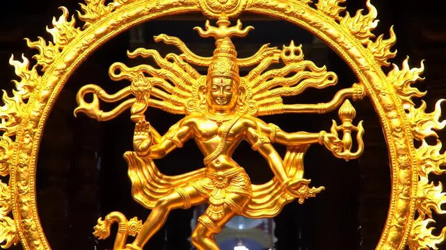 Golden Hindu deity statue detail.