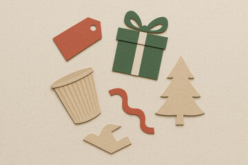 Minimalistic paper cut design of discarded holiday packaging. Abstract shapes from craft paper show creative concept about environmental awareness and festive wastefulness