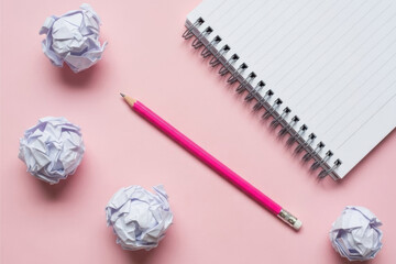 A collection of office and creative essentials on a soft pastel pink background