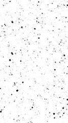 Obraz premium A textured background featuring a white surface with scattered black and gray speckles, creating a modern and artistic appearance.