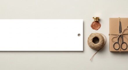 Overhead shot of gift wrapping supplies with blank tag for text.