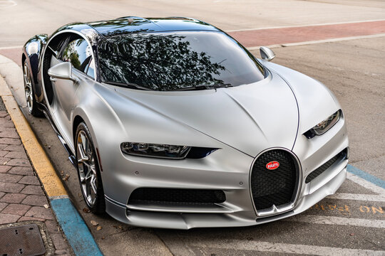 Miami, Florida, USA - April 02, 2025: Silver matter sport car, supercar corner view. Bugatti Chiron sport hypercar car. Luxury hypercar sportscar Bugatti Veyron. Car Bugatti Chiron parked outdoor.
