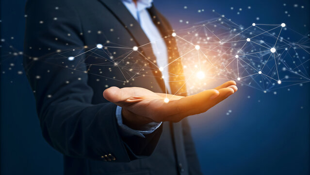 Businessman holding glowing digital network structure, symbolizing innovation and global connectivity in a modern business context. - Powered by Adobe