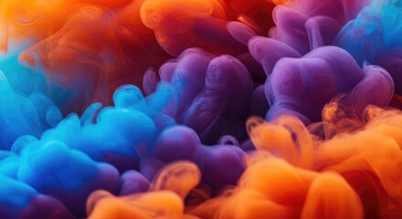 Vivid, swirling clouds of blue and orange ink blend in a dynamic, abstract explosion of color