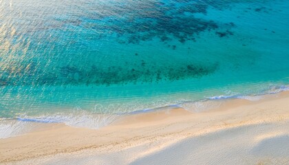 Aerial View of Clear Blue Ocean Waves Lapping Sandy Beach